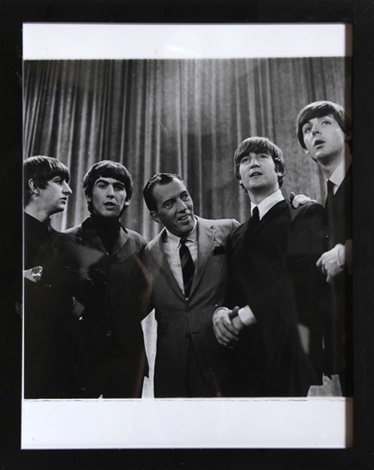 The Beatles and Ed Sullivan This is a picture of The Beatles with Ed Sullivan